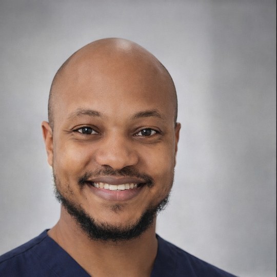 Joel Polley, RN, registered nurse and founder of BraveWorks RN, in navy scrubs